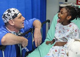 Doctor with child in ward