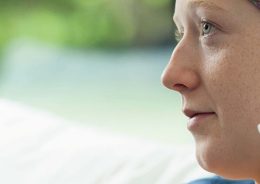 Woman receiving cancer treatment - looking thoughtful