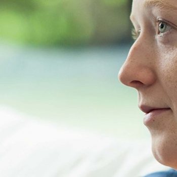 Woman receiving cancer treatment - looking thoughtful