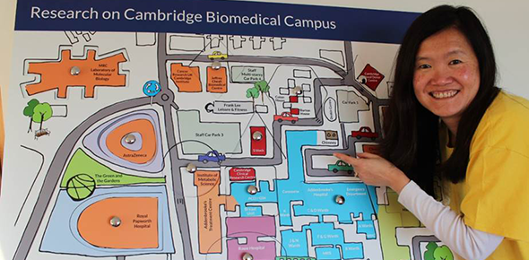 Former PPI Officer Treena with our giant puzzle board of the research happening on the Cambridge Biomedical Campus