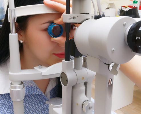 Picture of a woman looking into an eye device