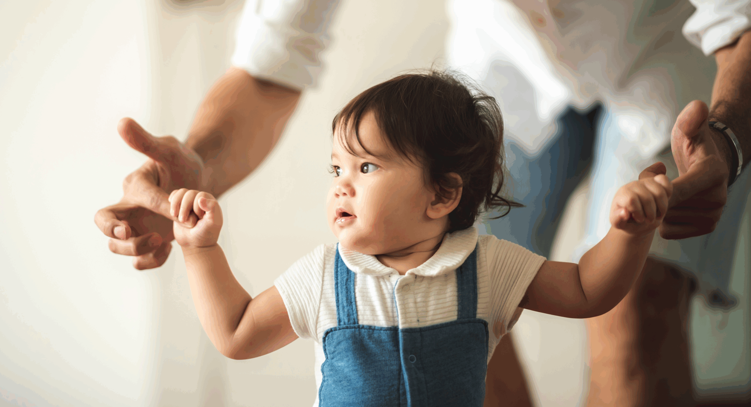 Young baby walking looking to the side