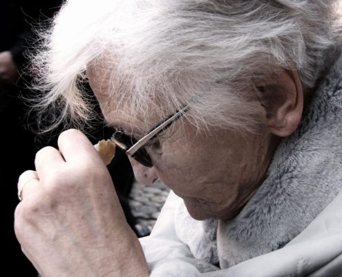 Old woman showing signs of dementia and confusion. Photo credit: Image by Gerd Altmann on Pixabay.