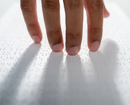 Hand reading braille